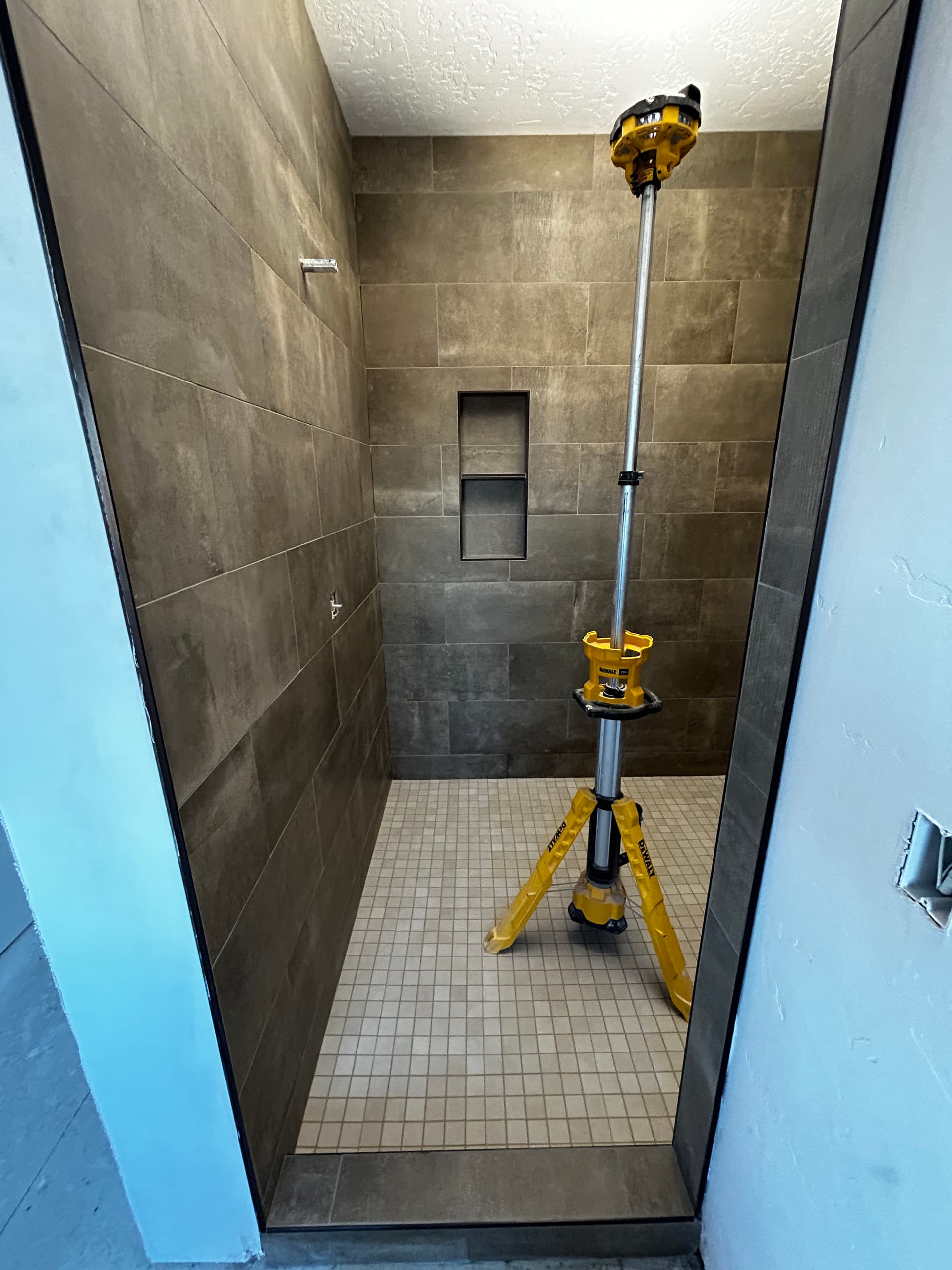 Stylish Master Shower Renovation with Modern Tile Design image