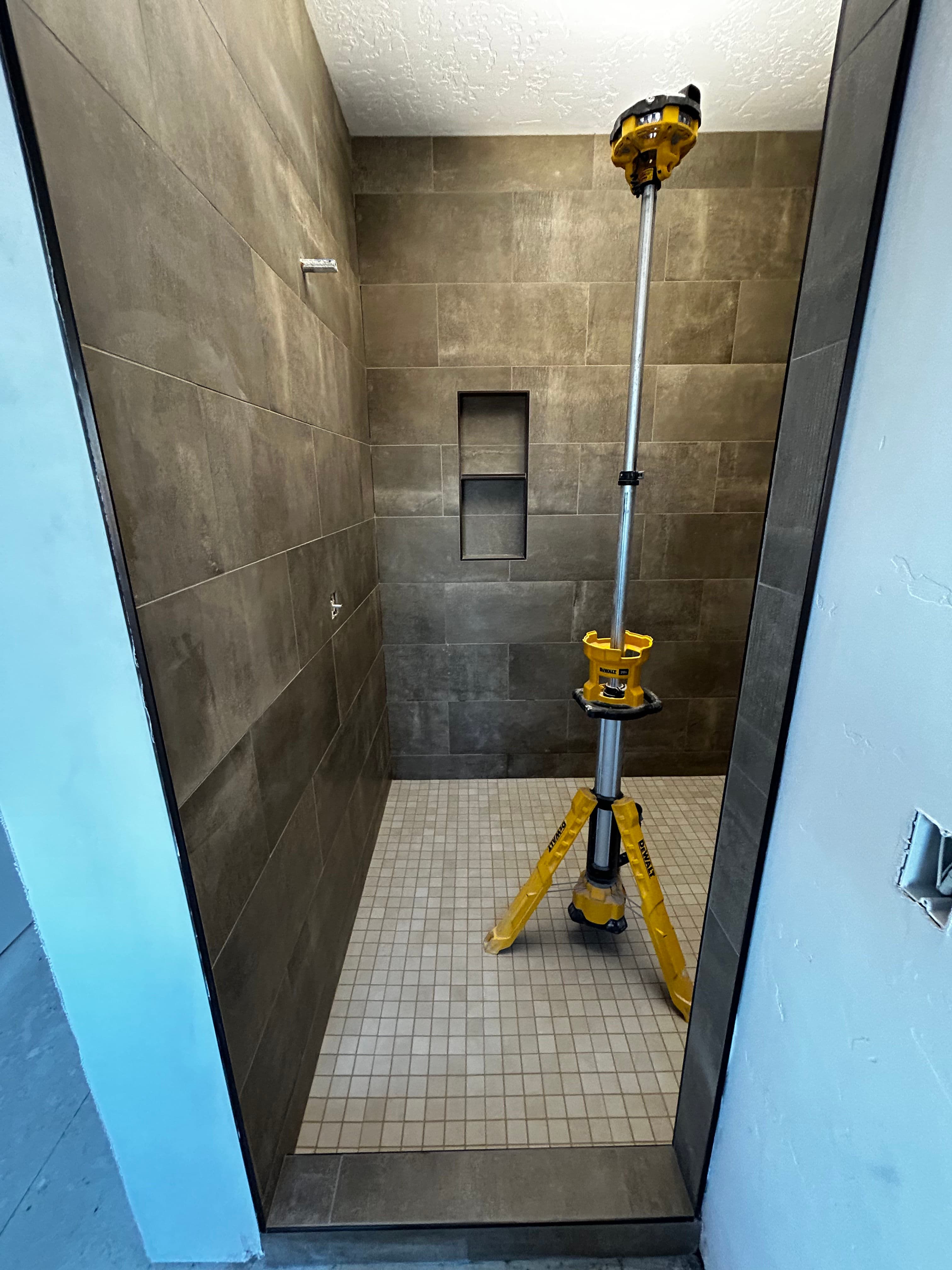 Project Stylish Master Shower Renovation with Modern Tile Design image